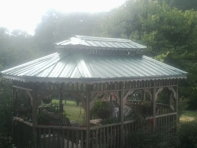 Two tier green metal roof on a garden gazebo in Jelm